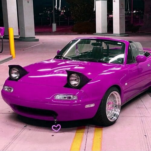 Purple sports car with a purple heart tow hook