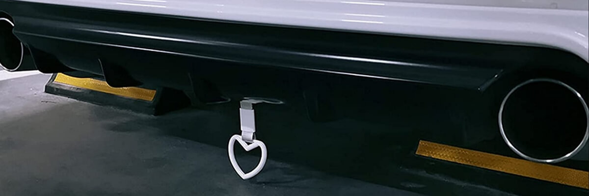 White car with a heart shaped towing ring