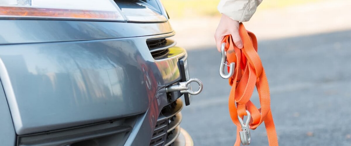 car with a tow hook and recovery strap